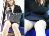 Panty shot voyeur video of glasses office lady on a face-to-face train